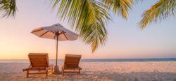 Luxury Mauritius Holidays | 2 Deckchairs and Parasol on Beach at Sunset